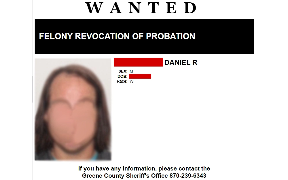 Screenshot of the details of a fugitive including their mugshot, full name, birthdate, sex, and race from the Greene County Sheriff's Office